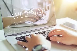 Laptop showing webinar.